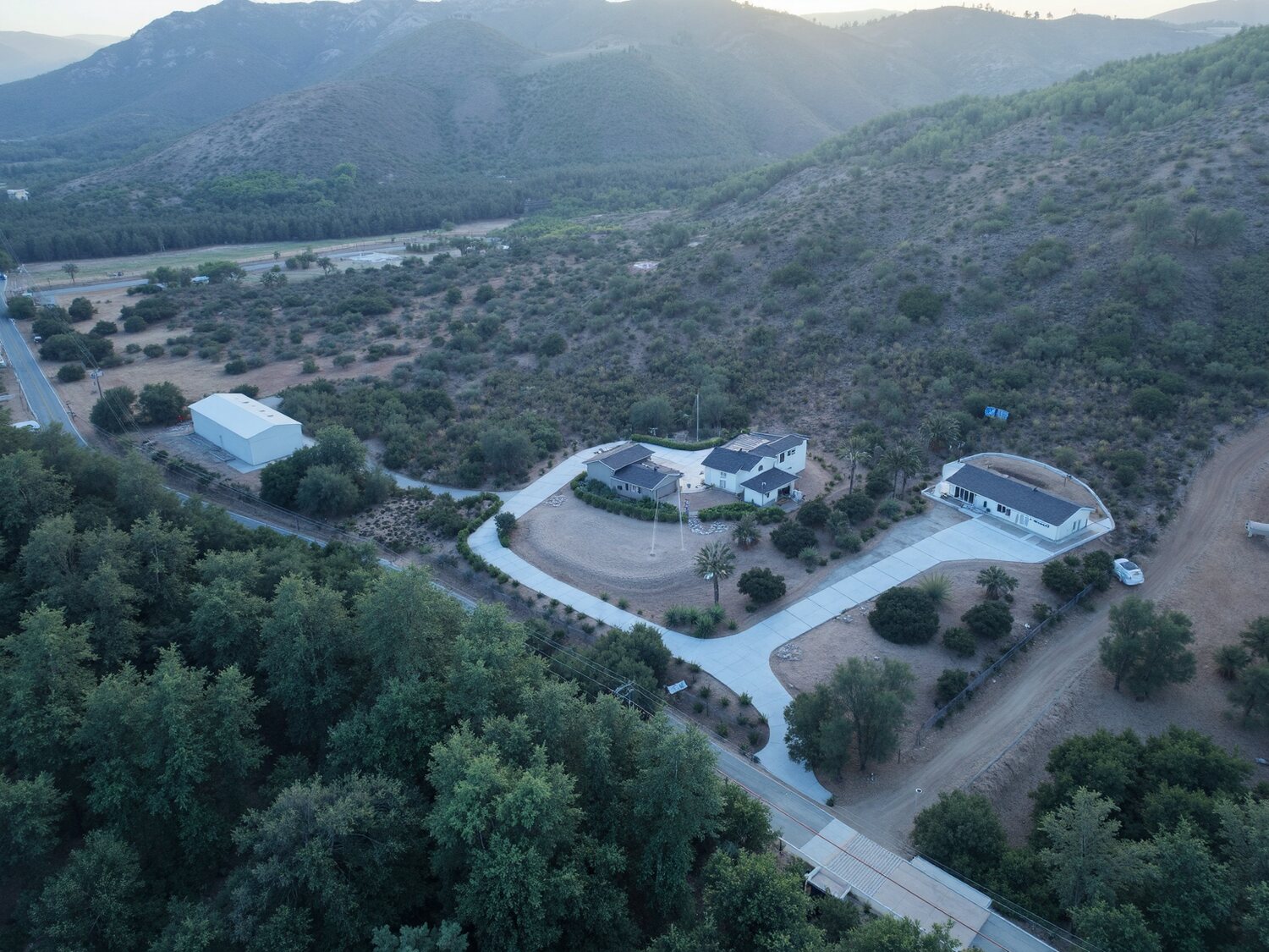 Aerial view of a protected hillside property in a valley